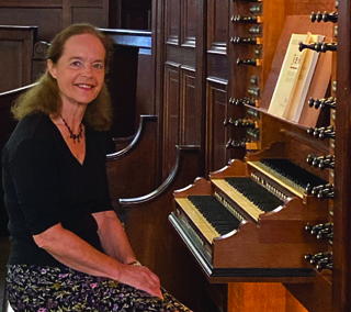 Photograph of Margaret Phillips seated at the organ of St George's Hanover Square, London